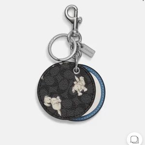 Coach Mirror Bag Charm in Signature Canvas Happy Dog Purse.